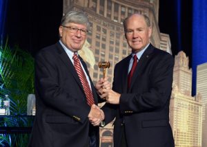 Jim Kessler receives the president's gavel from AREMA Past President Dwight W. Clark