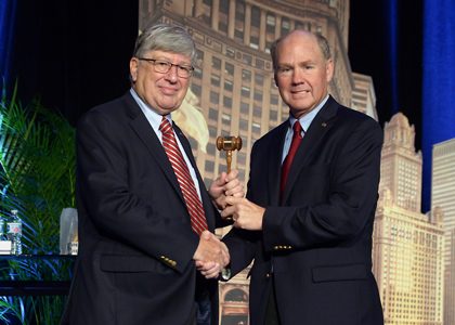 Jim Kessler receives the president's gavel from AREMA Past President Dwight W. Clark